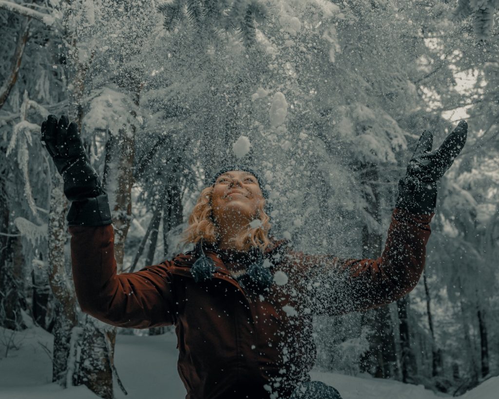 woman celebrating in snow