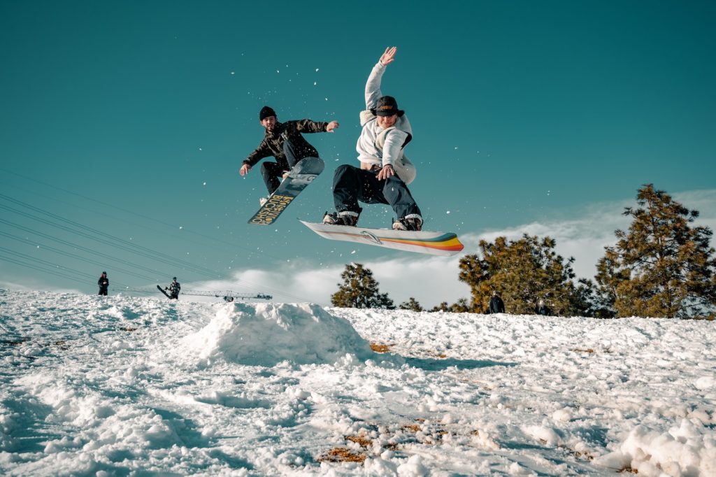 2 snowboarders on denver slopes
